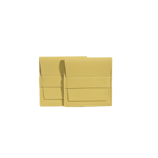 A yellow PU leather flip jewelry pouch featuring a sleek design with a front pocket. It has a logo on the surface.