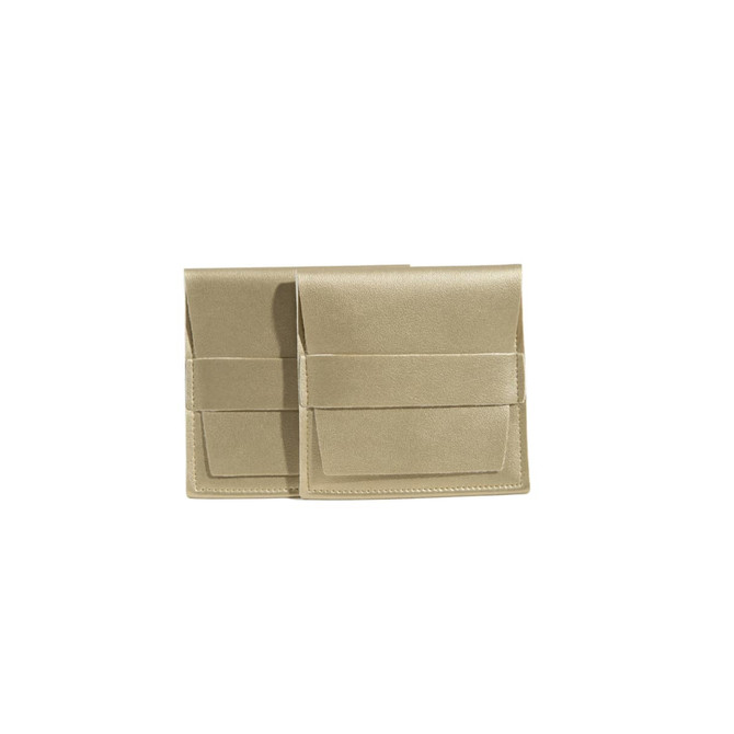 A pair of gold PU leather flip jewelry pouches with a textured finish and a sleek design.