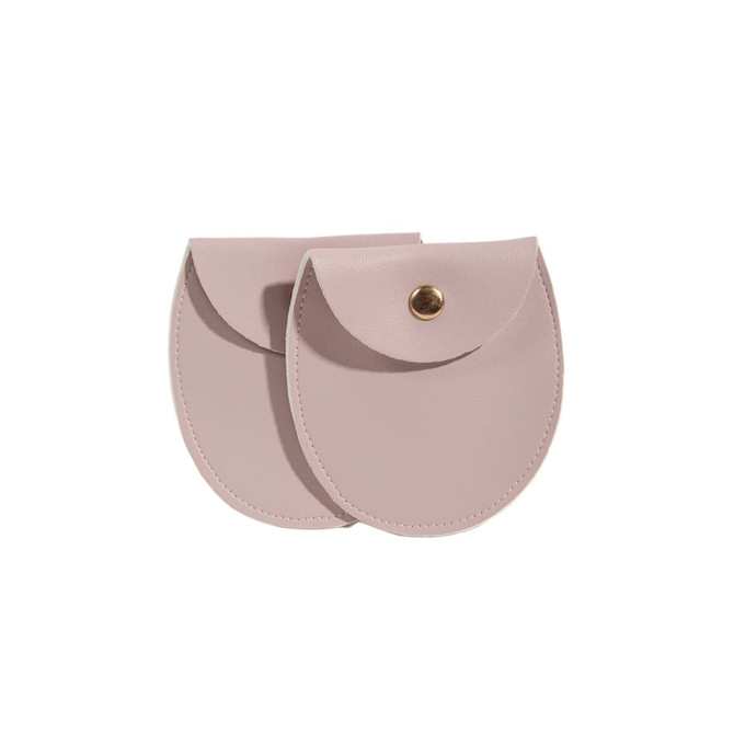 A oval PU leather jewellery pouch in a soft pink shade with a metal snap closure and a sleek design.