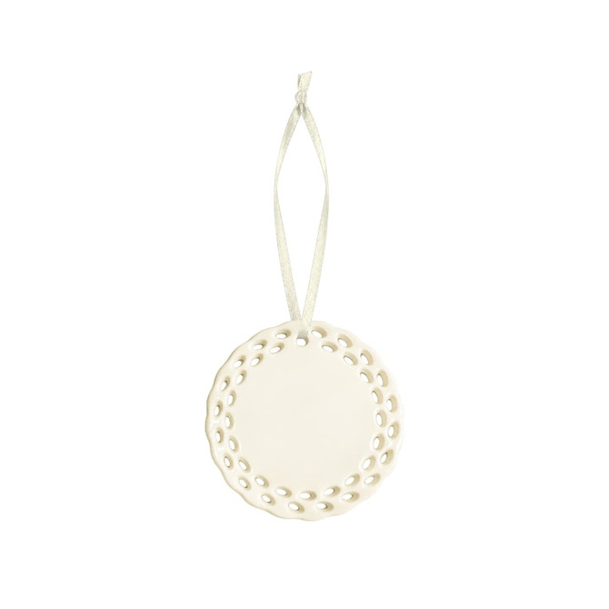 A ceramic ornament in white with a decorative perforated edge and a hanging ribbon.