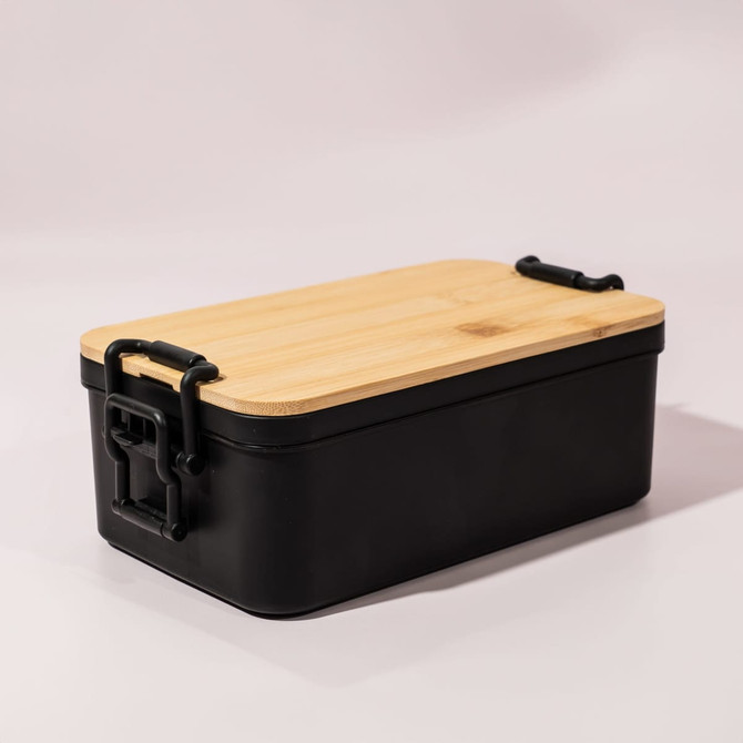 A black lunch box with a bamboo lid and metal clasps, featuring a sleek design and a modern look.