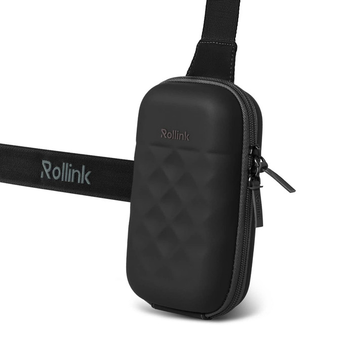A black travel pouch with a textured surface and an adjustable strap. It features a logo on the front.