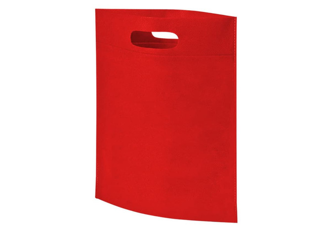 A red non-woven exhibition tote bag with a handle and no visible logo.