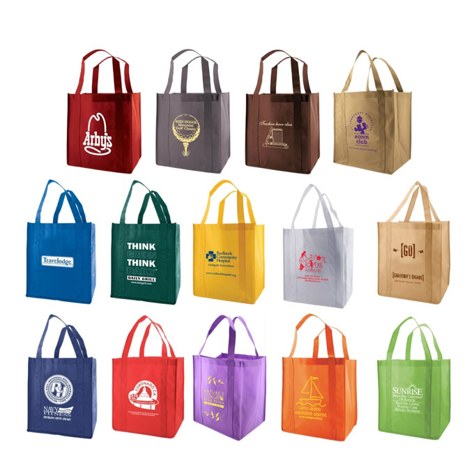 A collection of extra-large non-woven reusable grocery bags in various colours, featuring different logos.