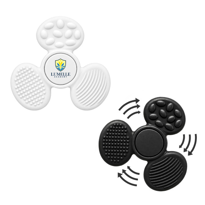 A tactile fidget spinner in white and black, featuring various textured surfaces and a central logo.
