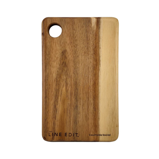 A wooden serving board with a natural finish and a circular hole, featuring a subtle brand logo.
