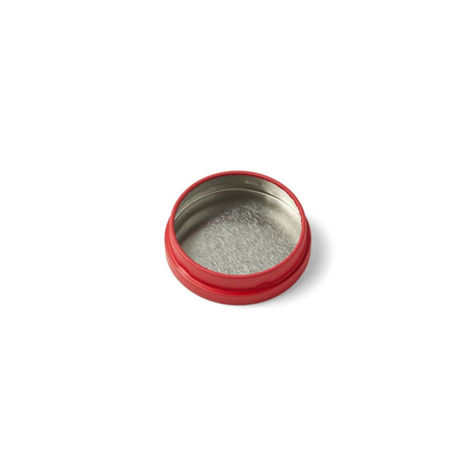 A red mini tin candle container with a shiny silver interior. It has a smooth, round design.