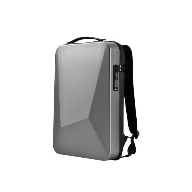 A silver expandable hardshell backpack with a geometric design and adjustable straps. It features a handle and a locking mechanism.