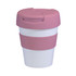 A reusable coffee cup in white and pink with a flip lid and silicone grip. It features a logo.