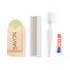 A brown paper-wrapped soap, a green-covered comb, a clear spatula, and a tube of white glue.
