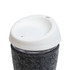 A reusable coffee cup featuring a glass body, a silicone lid, and a textured RPET band for grip.