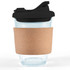 A reusable coffee cup featuring a clear glass body, a black snap lid, and a natural cork band for insulation and grip.