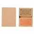 A card deck in a kraft box, featuring two sets of cards with intricate designs in orange and grey.