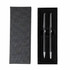 A black pen set displayed in an elegant box, featuring two matching pens and a soft interior lining.