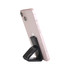 A pink smartphone propped up by a black sticky nano rubber pad. The pad has a sleek, minimalist design.