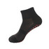 A pair of black children's gripper socks with a textured design and red non-slip grip on the sole.