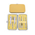 A stylish manicure set featuring stainless steel tools in a yellow case, including scissors, clippers, and nail files.