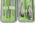 A stylish manicure set featuring stainless steel tools in a green case. Includes scissors, tweezers, and nail clippers.