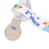 A silver medal with a drop-shaped design, attached to a white ribbon featuring colourful branding.