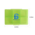 A green square pill box with six compartments, featuring a logo on the surface. Dimensions are 8.6cm x 5.9cm.