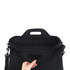 A black laptop bag with a handle, featuring a spacious interior and a shoulder strap attachment.