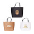 Three paper bags in black, brown, and white, featuring a logo on each and a decorative design on the black bag.