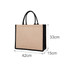 A jute tote bag with a natural coloured body and black handles, featuring dimensions of 42cm x 33cm x 15cm.