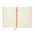 An open Genesis A5 notebook with lined pages and a red cover, featuring a red ribbon marker.
