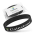 A black silicone wristband with debossed branding, presented in a clear package with a label.
