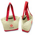 A canvas tote bag featuring a cream exterior with bright red handles and trim, along with a logo on the front.