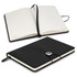 A black notebook gift set with a smooth cover, featuring a ribbon bookmark and elastic closure. It includes lined pages.