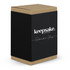 A black and kraft box containing the Keepsake Suburbia Glass, featuring a simple logo.