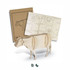 A wooden model of a cow in natural wood finish, alongside laser-cut components for assembly. Includes a branded packaging.