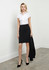 A fitted black skirt paired with a white blouse and black heels, featuring a simple design and professional look.