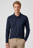 A navy long sleeve polo shirt with a collar, featuring a logo on the chest and paired with beige trousers.