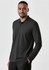 A long sleeve polo shirt in black, featuring a collar and a logo. Model is wearing the shirt.