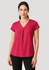 A woman models a fuchsia pink Women's Kayla V-Neck Pleat Blouse, featuring a pleat detail and short sleeves.