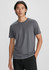A men's short sleeve tee in grey, featuring a simple design and fitted style. It has a logo on the chest.