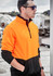 A unisex half-zip pullover in hi-vis orange and black, featuring a logo on the chest and a sleek design.
