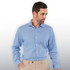 A men's button-up shirt in light blue, featuring a collar and long sleeves, with a subtle pattern and a logo.