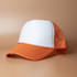 An orange and white trucker cap with a mesh back and an adjustable strap, featuring a logo on the front.
