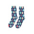 A pair of navy soccer socks featuring colourful, patterned circles in teal, peach, and pink. Includes a logo.