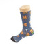 Colourful sock design featuring cartoon characters, predominantly in blue with orange, green, and yellow accents.