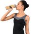 A drink bottle with a bamboo exterior and stainless steel interior, held by a person in activewear.
