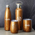 A drink bottle collection featuring wooden finish designs in various shapes and sizes, with logos displayed on some items.