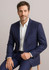 A navy two-button blazer jacket on a seated model, featuring a tailored fit and a pocket on the left side.