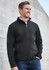 A black soft shell jacket featuring a zip front and side pockets, worn by a smiling man against a textured background.