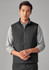 A black unisex reversible fleece vest displayed on a model, featuring a zip-up front and a simple design.