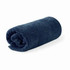 A rolled navy blue bath towel made from organic cotton, featuring a branding label.