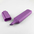 A purple highlighter with a chisel tip, accompanied by its matching cap.